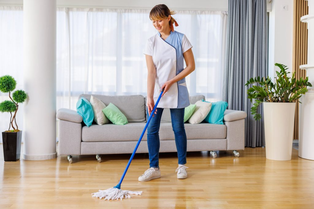 Picture of a female worker cleaning the floor