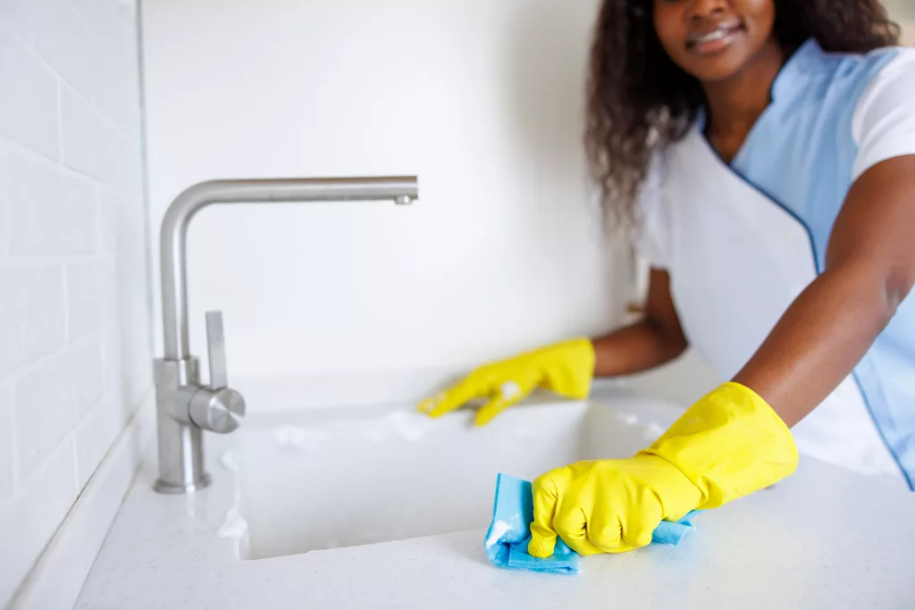Female worker doing professional deep cleaning services